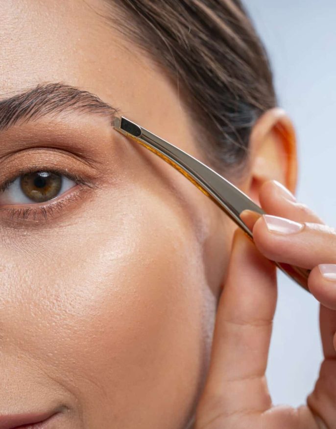 close-up-of-woman-tweezing-eyebrow-hair-2026-03-20-01-02-52-utc (1)